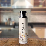 Wildflowers beige custom name script water bottle<br><div class="desc">A beige coloured background. Decorated with wildflowers in yellow and purple.  Personalize and add your name.   Grey handwritten style script.</div>