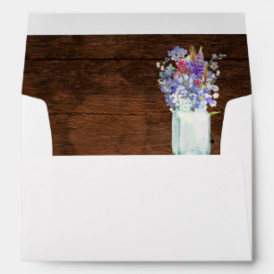 Wildflowers in Mason Jar Over Rustic Brown Wood Envelope