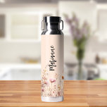 Wildflowers peach beige custom name script water bottle<br><div class="desc">A peach coloured background. Decorated with wildflowers in beige,  cream and pink.  Personalize and add your name.  Black handwritten style script.</div>