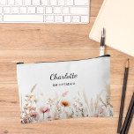 Wildflowers pink beige bridesmaid name accessory pouch<br><div class="desc">White background,  decorated with wildflowers in pink and beige.  Personalize and add the name of your bridesmaid.</div>