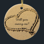 Will You Marry Me | Marriage Proposal Beach Heart Ceramic Ornament<br><div class="desc">What a romantic proposal idea! If you are about to propose and hoping she (or he) will say I do, try this beach wedding proposal idea. Beach theme Christmas ornament reads Will You Marry Me? inside a sandy beach photo with a heart drawn in the sand on the beach. It...</div>