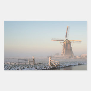 Windmill in the snow at sunrise rectangle sticker