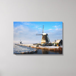Windmill in the snow in a dutch winter landscape canvas print