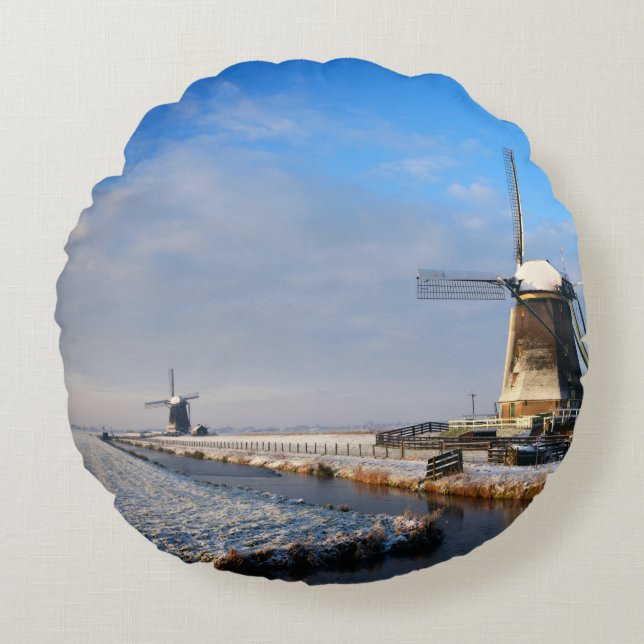 Windmill in the snow in a dutch winter landscape round pillow (Front)