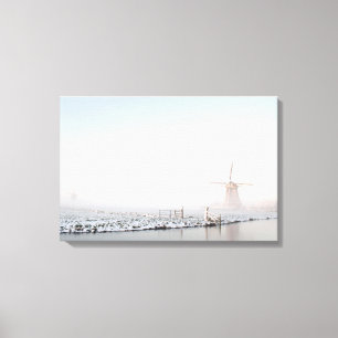 Windmill in the snow in winter canvas print