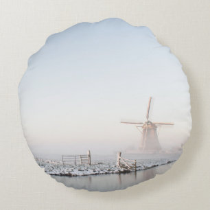 Windmill in the snow in winter round pillow