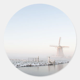 Windmill in the snow in winter round sticker