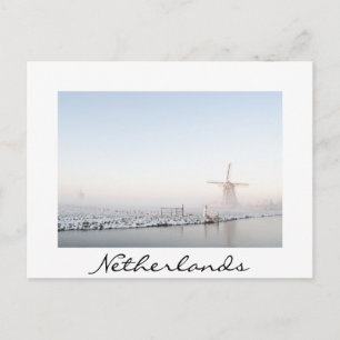 Windmill in the snow in winter white text postcard