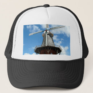 Windmill wing facing challenges bravely trucker hat