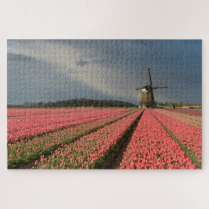 Windmill with pink tulips in spring jigsaw puzzle