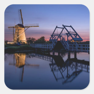 Windmills and a drawbridge at sunset sticker