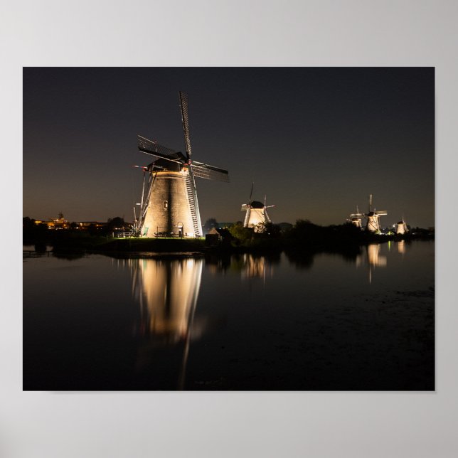 Windmills illuminated at night poster print (Front)