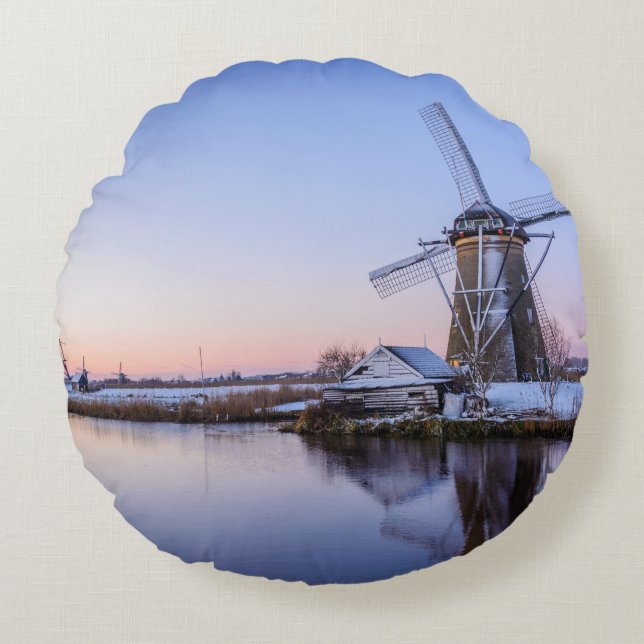 Windmills in winter during a sunrise round pillow (Front)