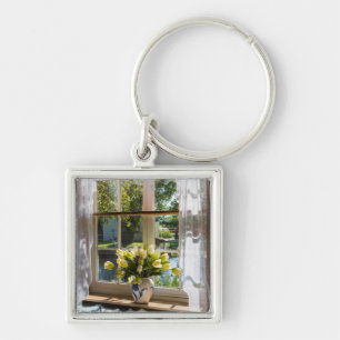 Window with lace curtain and tulips keychain