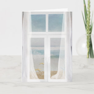 window with sheer curtain and ocean view card