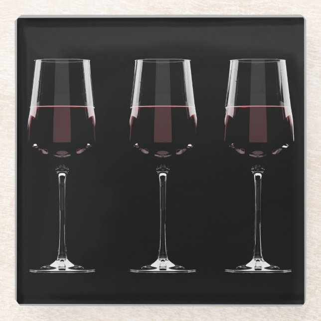 Wine glasses with red wine on black glass coaster (Front)