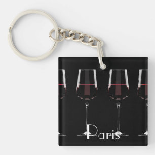 Wine glasses with red wine on black keychain