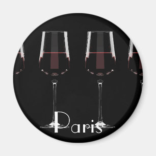 Wine glasses with red wine on black magnet