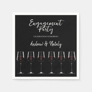 Wine glasses with red wine on black napkin