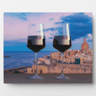Wine glasses with view of sunset over Valletta Can Plaque