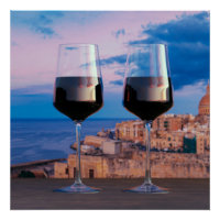 Wine glasses with view of sunset over Valletta