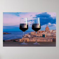 Wine glasses with view of sunset over Valletta