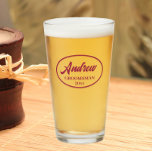 Wine Red Stylized Wedding Groomsman Name Glass<br><div class="desc">Beer glass for the wedding groomsman that features his name printed in a trendy, wine red colour, stylized script inside a wine red colour oval border along with wedding year date. A great party supply idea for a bachelor party! Personalize your beer glass by editing and replacing name and date...</div>