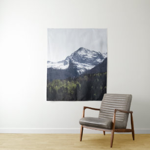 Winter and Spring - green trees and snowy mountain Tapestry