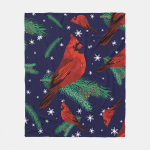 Winter birds - cardinals on fir-tree branches with fleece blanket