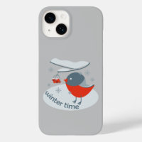 Winter bullfinch bird and red rowan berries