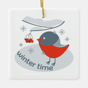 Winter bullfinch bird and red rowan berries  ceramic ornament