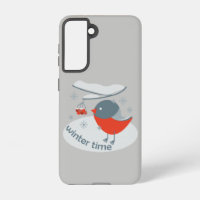 Winter bullfinch bird and red rowan berries
