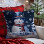 Winter Forest Snowman Christmas | Blue Throw Pillow<br><div class="desc">Bring joy and whimsy to your seasonal decor with this charming Blue Winter Forest Holiday Throw Pillow. Featuring a smiling snowman dressed in a classic top hat and cozy scarf, the design captures the magic of a wintry scene with softly falling snow and delicate white snowflakes. Nestled among frosted trees,...</div>