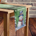 Winter Forest Snowman Christmas | Green Medium Table Runner<br><div class="desc">Add a festive and whimsical touch to your home decor this holiday season with a Green Winter Forest Snowman Christmas Table Runner. Table runner design features a cute snowman in a charming top hat and scarf standing in a winter forest scene with falling snow. Additional holiday home decor available with...</div>