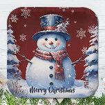 Winter Forest Snowman Christmas | Red Paper Plate<br><div class="desc">Bring the charm of a winter forest to your holiday gatherings and Christmas parties with this Red Winter Forest Snowman Paper Plates. These sturdy plates feature a delightful smiling snowman surrounded by snowy pine trees and white snowflakes, with falling snow adding a festive touch. The festive script displaying "Merry Christmas"...</div>