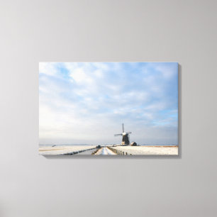 Winter landscape with snow and windmill in Holland Canvas Print