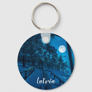 Winter landscape with snow covered pine forest keychain
