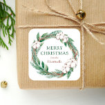 Winter Merry Christmas Watercolor Greenery Wreath Square Sticker<br><div class="desc">This personalized holiday sticker features a watercolor wreath of green and brown winter greenery,  including pine sprigs and cotton. The words "Merry Christmas" appear in green serif font. Personalize the design with your family name below in brown italics.</div>