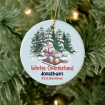 Winter Onederland First Christmas Cute Penguins Ceramic Ornament<br><div class="desc">Frosty Penguin Extravaganza: Celebrate your little one's first Christmas with a frosty design featuring a heartwarming scene of a mother and baby penguin riding a sleigh through a snowy forest. The clever play on words with "Winter Onederland" adds a touch of whimsy, and the customizable text ensures this invitation suits...</div>