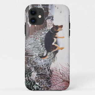 Winter snow scene with cute black and tan dog iPhone 11 case
