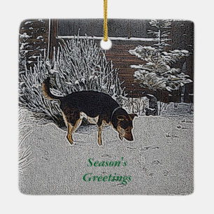 winter snow scene with cute black and tan dog ceramic ornament