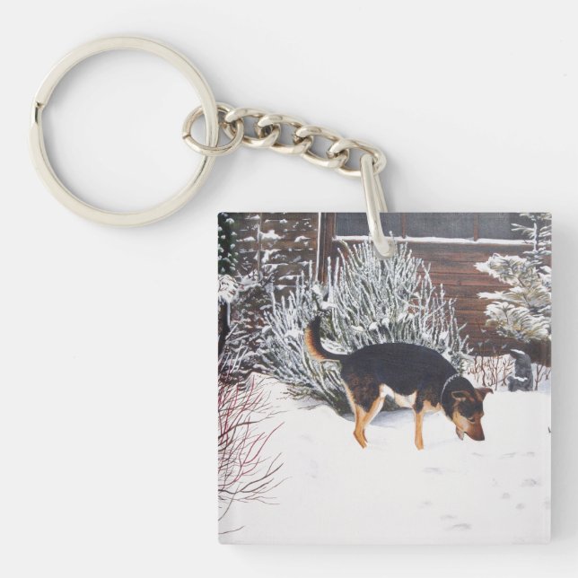 Winter snow scene with cute black and tan dog keychain (Front)