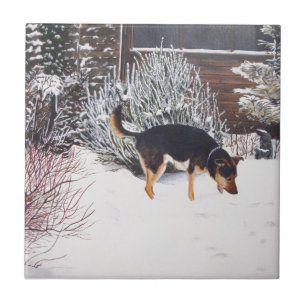 Winter snow scene with cute black and tan dog tile