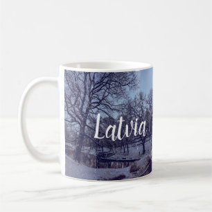 Winter snowy city park in the evening coffee mug
