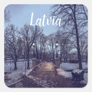 Winter snowy city park in the evening square sticker