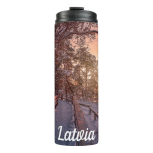 Winter sunset in pine forest near sea thermal tumbler