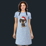 Wirehaired Dachshund Santa Teckel Christmas Dog Apron<br><div class="desc">Bring some canine Christmas cheer into the kitchen with this adorable holiday baking apron! The front features a large print cartoon-style drawing of a wirehaired dachshund wearing a bright red Santa hat atop its cute floppy ears. This adorable teckel apron is the perfect accessory for baking up batches of holiday...</div>