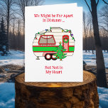 Wishing You a Merry Christmas from a Traveller Card<br><div class="desc">Wishing you a Merry Christmas from the road! A cute birthday card for someone who is travelling at Christmas time. A cute RV camper in red and green decorated with Christmas lights. Hand drawn cartoon. Wishing you a Merry Christmas and an Adventurous New Year.</div>