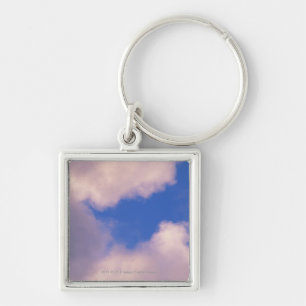 Wispy clouds against blue sky keychain