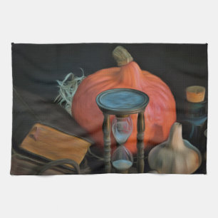 Witchery objects on a table in a dark room kitchen towel